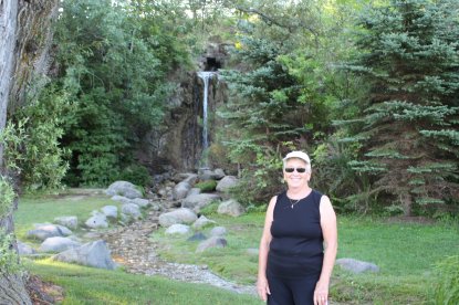 Joyce in front of waterfall